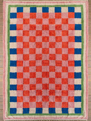Green, blue, pink and red chequered tufted rug