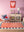Living room with a colorful checkered rug, red chair, and pink wall with a heart-shaped painting.